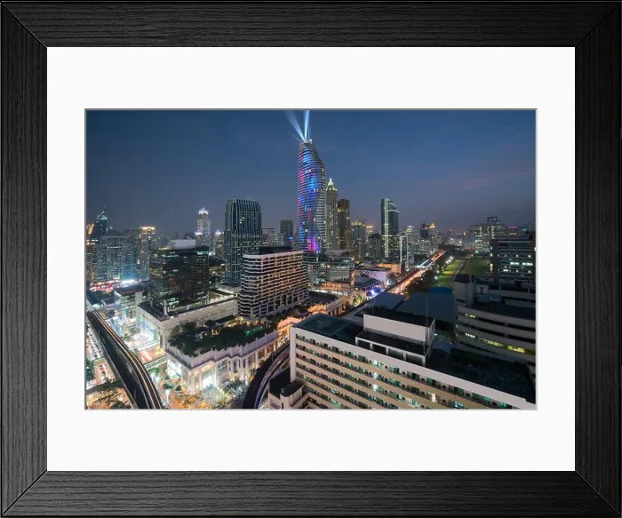 Framed Print : Night view with skyscraper in business district in Bangkok Thailand. Light show at Magnolias Ratchaprasong in Bangkok, Thailand Framed Print : Night view with skyscraper in business district in Bangkok Thailand. Light show at Magnolias Ratchaprasong in Bangkok, Thailand