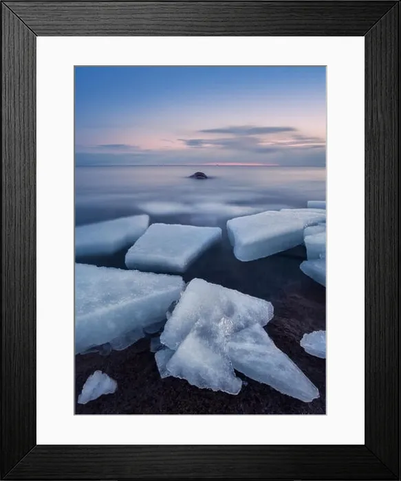 Framed Print : Scenic landscape with ice cubes and sunset at evening in Finland Framed Print : Scenic landscape with ice cubes and sunset at evening in Finland