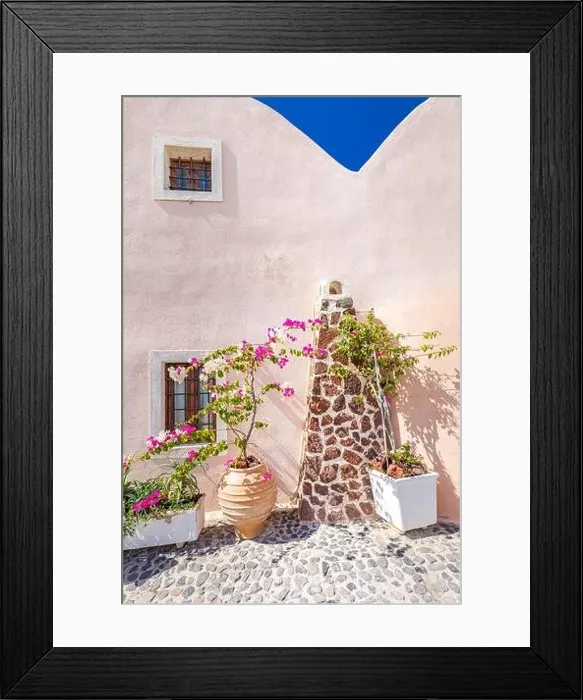 Framed Print : Traditional famous white blue houses wih flowers under sunny weather over the Caldera, Aegean sea. Beautiful summer landscape, sea view, luxury travel Framed Print : Traditional famous white blue houses wih flowers under sunny weather over the Caldera, Aegean sea. Beautiful summer landscape, sea view, luxury travel