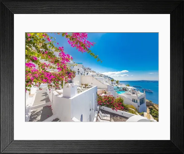 Framed Print : Traditional famous white blue houses wih flowers under sunny weather over the Caldera, Aegean sea. Beautiful summer landscape, sea view, luxury travel Framed Print : Traditional famous white blue houses wih flowers under sunny weather over the Caldera, Aegean sea. Beautiful summer landscape, sea view, luxury travel