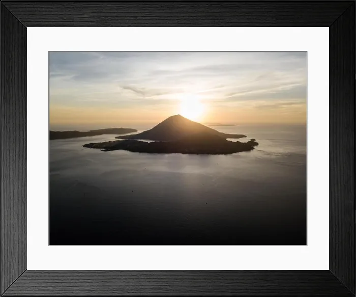 Framed Print : The sun sets behind Banda Neira, an active volcano in the Banda Sea. This region is in the Coral Triangle and has high marine biodiversity Framed Print : The sun sets behind Banda Neira, an active volcano in the Banda Sea. This region is in the Coral Triangle and has high marine biodiversity