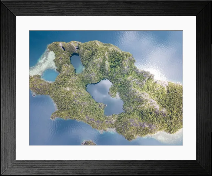 Framed Print : The remote limestone islands of Misool in Raja Ampat are surrounded by calm seas and healthy reefs. This tropical region has high marine biodiversity