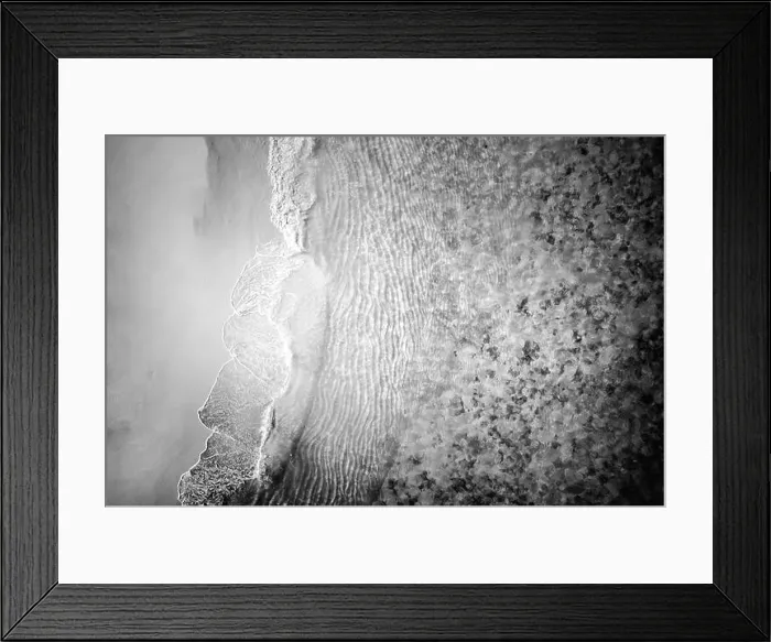 Framed Print : Aerial drone shoot from above black sand beach. Nature texture, monochrome process, beach landscape, tropical pattern Framed Print : Aerial drone shoot from above black sand beach. Nature texture, monochrome process, beach landscape, tropical pattern