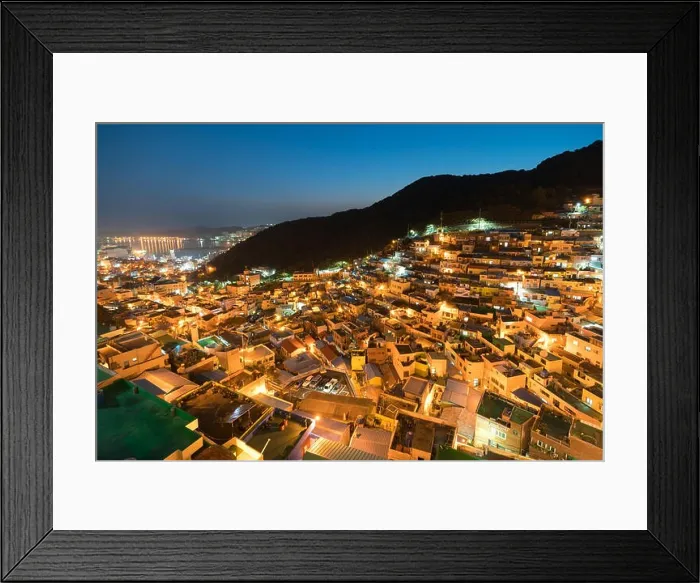 Framed Print : Gamcheon Culture Village formed by houses built in staircase-fashion on the foothills of a coastal mountain at night in Busan, South Korea Framed Print : Gamcheon Culture Village formed by houses built in staircase-fashion on the foothills of a coastal mountain at night in Busan, South Korea
