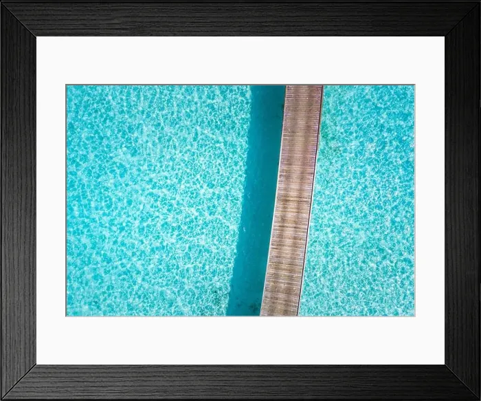 Framed Print : Exotic aerial view of turquoise water with wooden jetty in Maldives islands. Amazing sea lagoon. Tropical ocean water, sunny weather, abstract aerial Framed Print : Exotic aerial view of turquoise water with wooden jetty in Maldives islands. Amazing sea lagoon. Tropical ocean water, sunny weather, abstract aerial