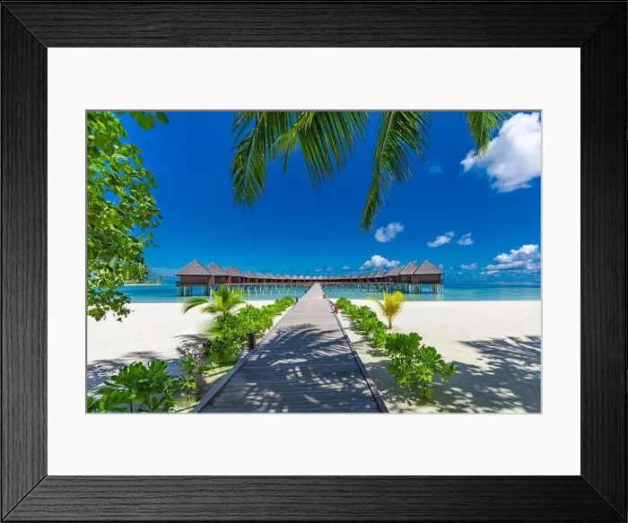 Framed Print : Beautiful Maldives island landscape beach with water villas. Long jetty under palm leaves, luxury summer travel destination. Amazing vacation Framed Print : Beautiful Maldives island landscape beach with water villas. Long jetty under palm leaves, luxury summer travel destination. Amazing vacation