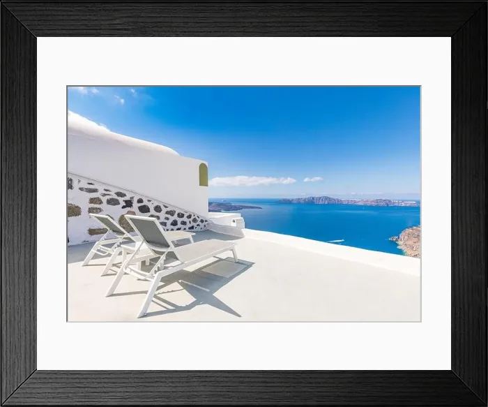 Framed Print : Chaise lounge in Santorini, Greece. Europe travel destination, luxury resort terrace, caldera sea view. Relaxing, peaceful vibes, summer mood. Romance Framed Print : Chaise lounge in Santorini, Greece. Europe travel destination, luxury resort terrace, caldera sea view. Relaxing, peaceful vibes, summer mood. Romance