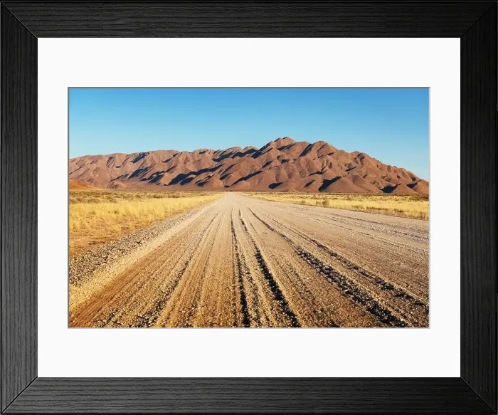Framed Print : Gravel road and beautiful landscape with sunset sky in Namibia, Africa Framed Print : Gravel road and beautiful landscape with sunset sky in Namibia, Africa