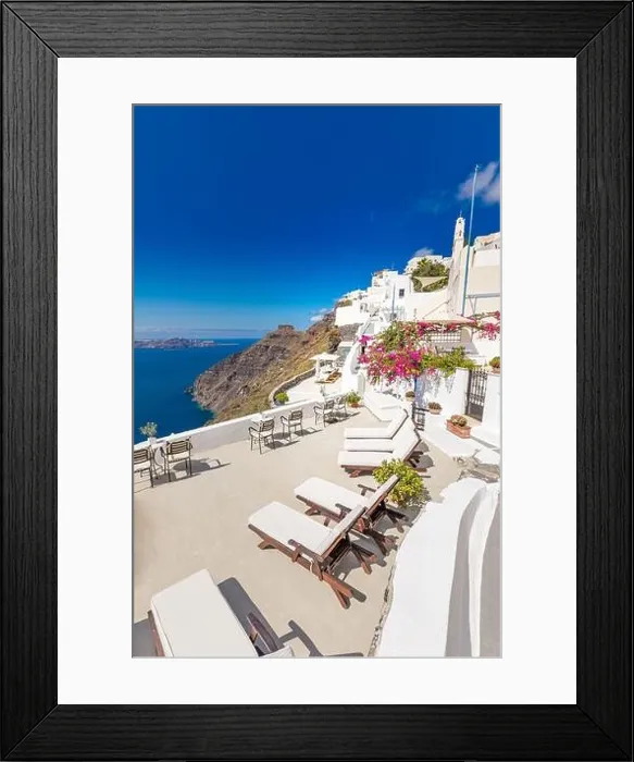 Framed Print : White architecture on Santorini island, Greece. Beautiful landscape with sea view. Chairs with flowers, romantic terrace sea view. Luxury travel Framed Print : White architecture on Santorini island, Greece. Beautiful landscape with sea view. Chairs with flowers, romantic terrace sea view. Luxury travel