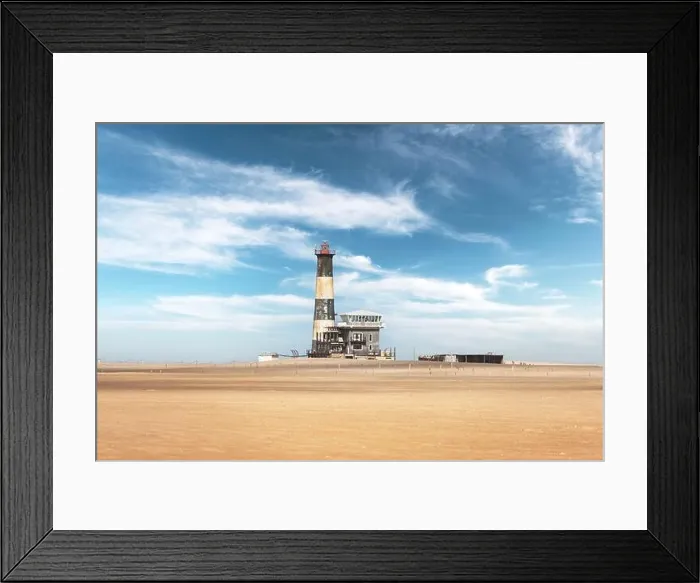 Framed Print : The oceanfront lighthouse at Sandwich Harbour in Namibia, Africa. Landscape drone photography Framed Print : The oceanfront lighthouse at Sandwich Harbour in Namibia, Africa. Landscape drone photography