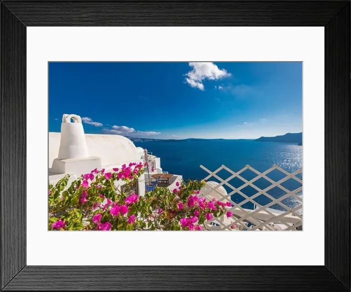 Framed Print : Artistic travel landscape, Santorini, Greece. Famous view of traditional white architecture landscape with flowers in foreground. Summer vacation Framed Print : Artistic travel landscape, Santorini, Greece. Famous view of traditional white architecture landscape with flowers in foreground. Summer vacation