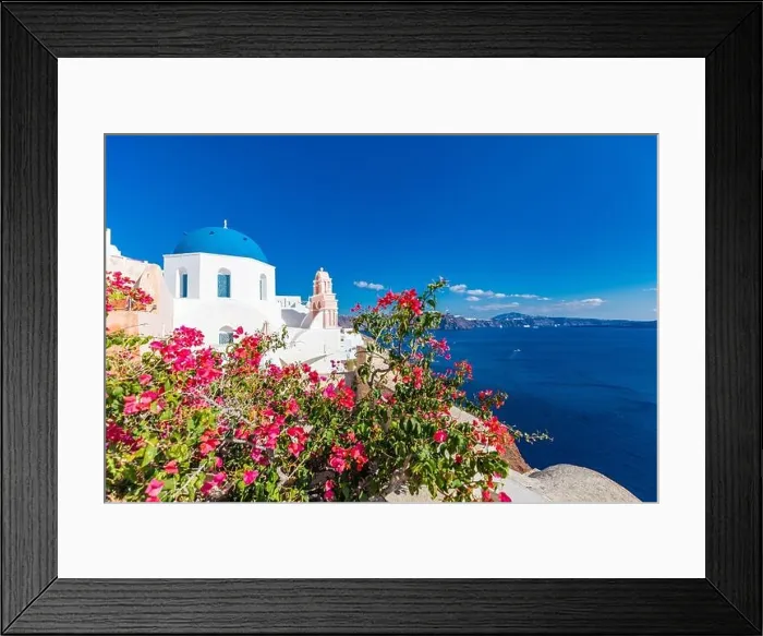 Framed Print : Artistic travel landscape, Santorini, Greece. Famous view of traditional white architecture landscape with flowers in foreground. Summer vacation Framed Print : Artistic travel landscape, Santorini, Greece. Famous view of traditional white architecture landscape with flowers in foreground. Summer vacation