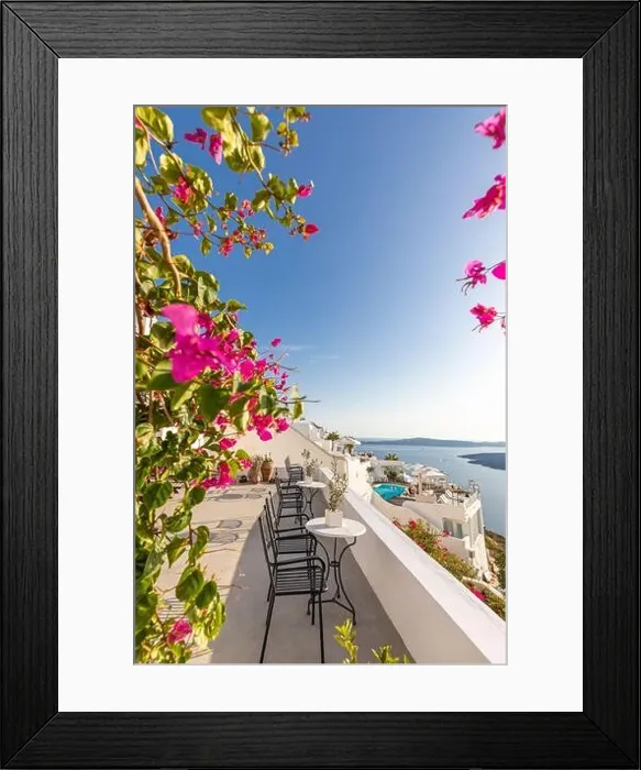 Framed Print : White architecture on Santorini island, Greece. Beautiful landscape with sea view. Chairs with flowers, romantic terrace sea view. Luxury travel Framed Print : White architecture on Santorini island, Greece. Beautiful landscape with sea view. Chairs with flowers, romantic terrace sea view. Luxury travel