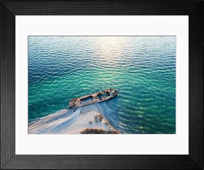Framed Print : Old shipwreck reinforced concrete barge abandoned stand on beach on the coast of Black sea in Ukraine Framed Print : Old shipwreck reinforced concrete barge abandoned stand on beach on the coast of Black sea in Ukraine