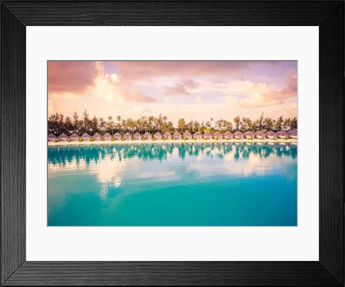 Framed Print : Beautiful colorful sunset at tropical island on Maldives in Indian Ocean. Luxury beach villas with palm trees. Amazing summer destination scenic relax Framed Print : Beautiful colorful sunset at tropical island on Maldives in Indian Ocean. Luxury beach villas with palm trees. Amazing summer destination scenic relax