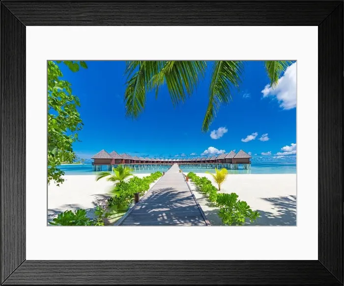 Framed Print : Luxury travel destination. Amazing summer beach landscape, water villas under palm trees, white sand and blue sky. Idyllic vacation leisure holiday Framed Print : Luxury travel destination. Amazing summer beach landscape, water villas under palm trees, white sand and blue sky. Idyllic vacation leisure holiday