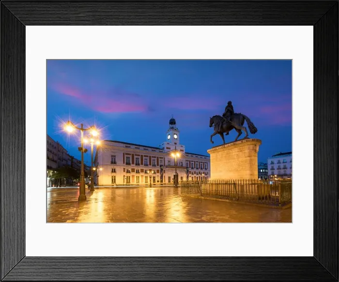 Framed Print : Madrid cityscape at night. Landscape of Puerta del Sol square Km 0. Historical building in Puerta del Sol square area at Madrid, Spain Framed Print : Madrid cityscape at night. Landscape of Puerta del Sol square Km 0. Historical building in Puerta del Sol square area at Madrid, Spain