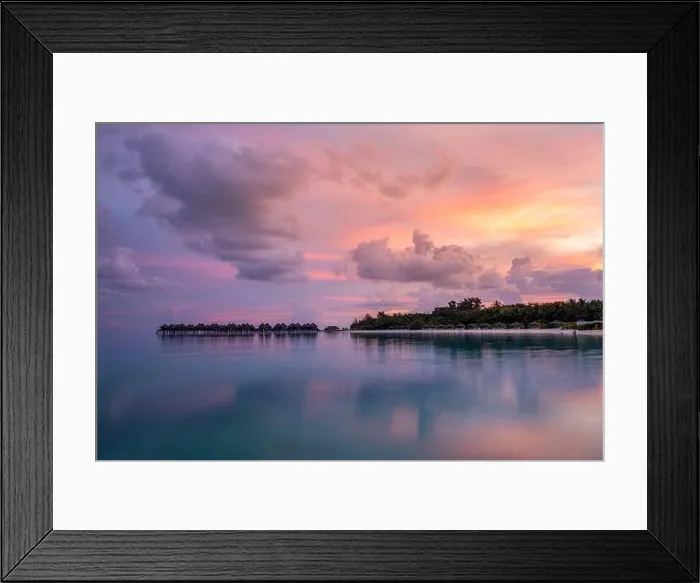 Framed Print : Over water bungalows with amazing lagoon reflection. Colorful sky clouds over tropical island. Summer paradise, luxury landscape. Destination scenic Framed Print : Over water bungalows with amazing lagoon reflection. Colorful sky clouds over tropical island. Summer paradise, luxury landscape. Destination scenic