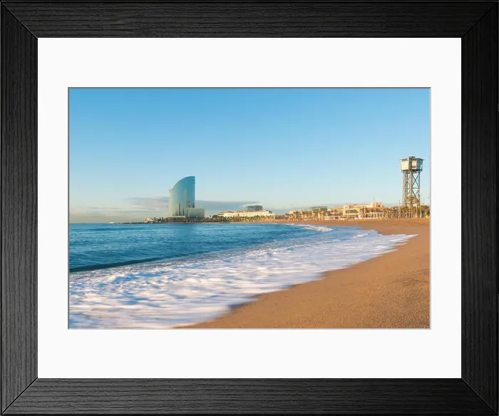 Framed Print : Barceloneta Beach in Barcelona with colorful sky at sunrise. Seafront, beach, coast in Spain. Suburb of Barcelona, Catalonia Framed Print : Barceloneta Beach in Barcelona with colorful sky at sunrise. Seafront, beach, coast in Spain. Suburb of Barcelona, Catalonia