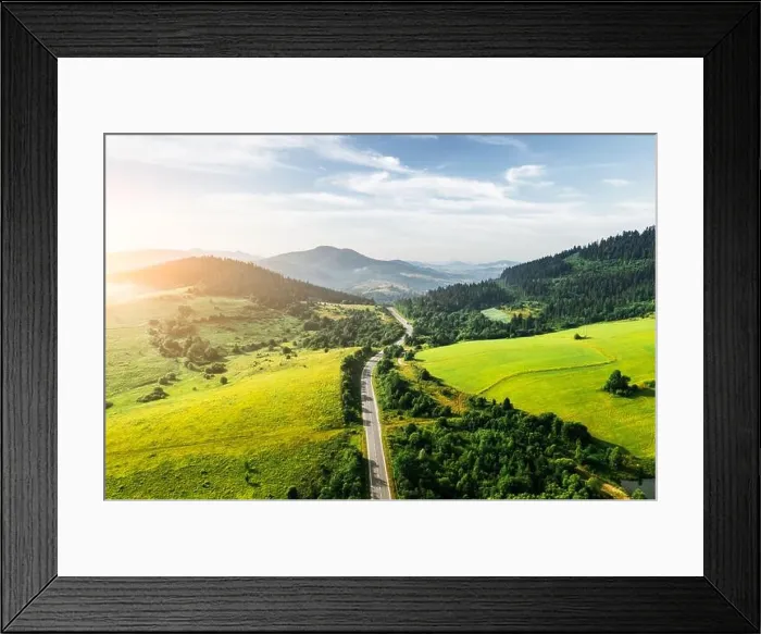 Framed Print : Flight over the summer mountains with mountain road serpentine, green fields and forest. Ukraine, Carpathian mountains. Landscape photography Framed Print : Flight over the summer mountains with mountain road serpentine, green fields and forest. Ukraine, Carpathian mountains. Landscape photography
