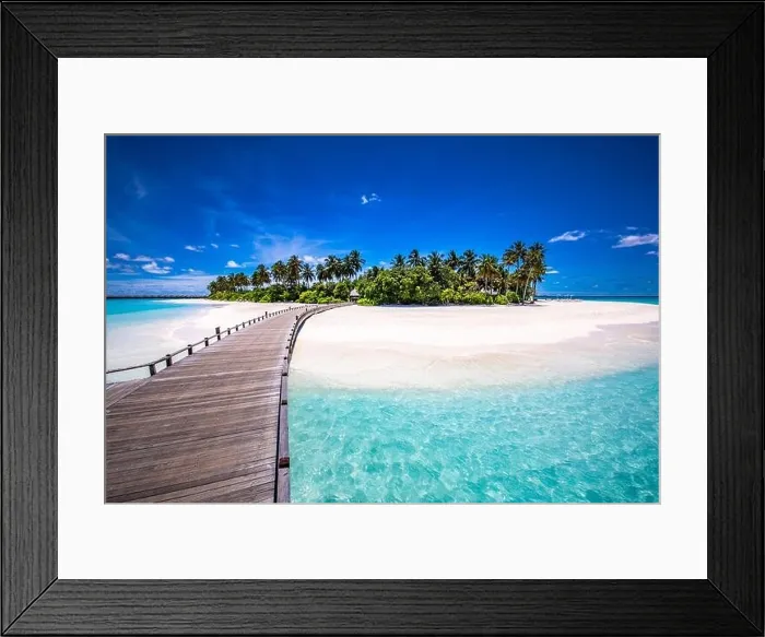 Framed Print : Maldives beach resort panoramic landscape. Tropical vacation beach. Long wooden pier, jetty into paradise island, palm trees, white sand, blue sky Framed Print : Maldives beach resort panoramic landscape. Tropical vacation beach. Long wooden pier, jetty into paradise island, palm trees, white sand, blue sky