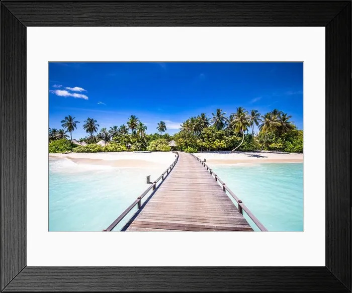 Framed Print : Maldives beach resort panoramic landscape. Tropical vacation beach. Long wooden pier, jetty into paradise island, palm trees, white sand, blue sky Framed Print : Maldives beach resort panoramic landscape. Tropical vacation beach. Long wooden pier, jetty into paradise island, palm trees, white sand, blue sky