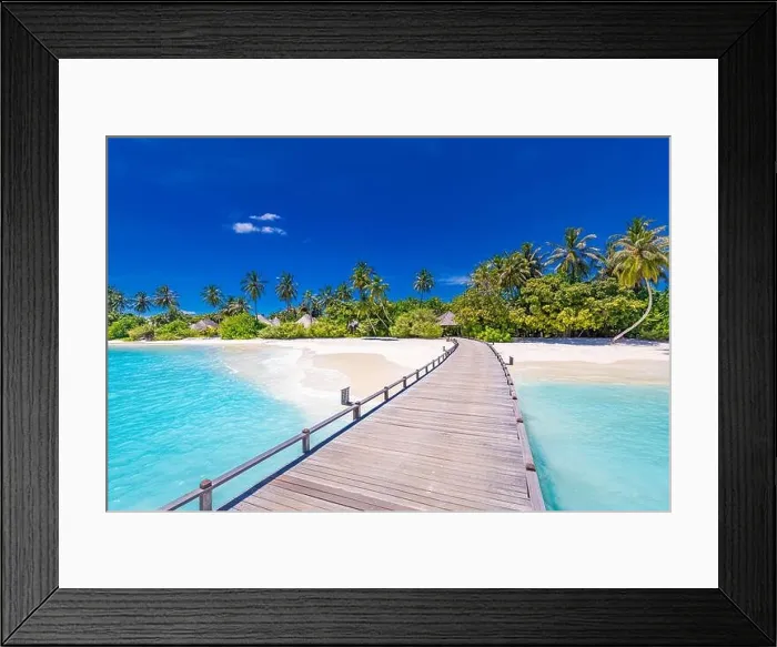 Framed Print : Maldives beach resort panoramic landscape. Tropical vacation beach. Long wooden pier, jetty into paradise island, palm trees, white sand, blue sky Framed Print : Maldives beach resort panoramic landscape. Tropical vacation beach. Long wooden pier, jetty into paradise island, palm trees, white sand, blue sky