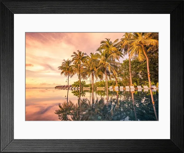 Framed Print : Infinity pool reflection landscape. Luxurious beach resort, swimming pool and beach chairs or loungers under umbrellas with palm trees sunset sky Framed Print : Infinity pool reflection landscape. Luxurious beach resort, swimming pool and beach chairs or loungers under umbrellas with palm trees sunset sky