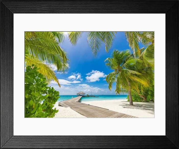 Framed Print : Maldives beach resort panoramic landscape. Tropical vacation beach. Long wooden pier, jetty into paradise island, palm trees, white sand, blue sky Framed Print : Maldives beach resort panoramic landscape. Tropical vacation beach. Long wooden pier, jetty into paradise island, palm trees, white sand, blue sky