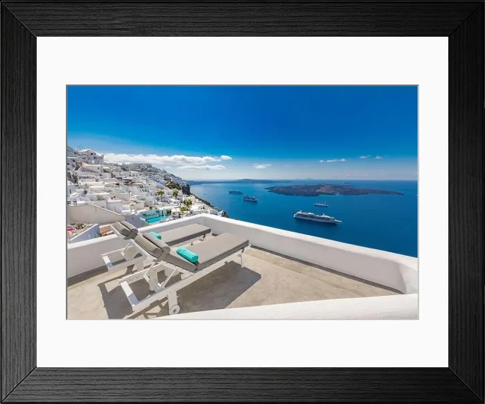 Framed Print : Santorini island, Greece. Travel and vacation concept, amazing summer view, white architecture blue sea view cruise ships. Lounge chairs luxury resort Framed Print : Santorini island, Greece. Travel and vacation concept, amazing summer view, white architecture blue sea view cruise ships. Lounge chairs luxury resort