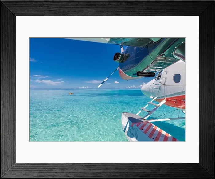 Framed Print : Seaplane at tropical beach resort. Amazing summer travel vacation view. Perfect blue sea view with Maldives islands, transportation, plane, seascape Framed Print : Seaplane at tropical beach resort. Amazing summer travel vacation view. Perfect blue sea view with Maldives islands, transportation, plane, seascape