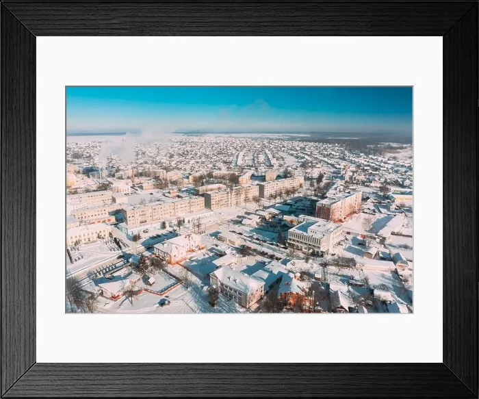 Framed Print : Dobrush, Gomel Region, Belarus. Aerial View Of Skyline Cityscape In Sunny Winter Day. Snowy Landscape Cityscape Skyline Framed Print : Dobrush, Gomel Region, Belarus. Aerial View Of Skyline Cityscape In Sunny Winter Day. Snowy Landscape Cityscape Skyline