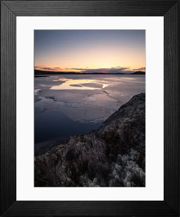 Framed Print : Scenic spring landscape with melted ice and sunset at evening light in Finland Framed Print : Scenic spring landscape with melted ice and sunset at evening light in Finland