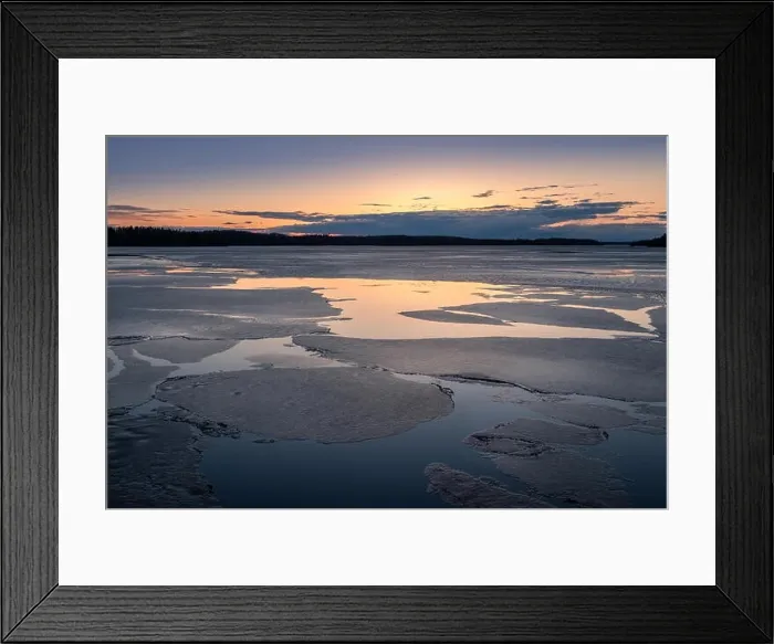 Framed Print : Scenic spring landscape with melted ice and sunset at evening light in Finland Framed Print : Scenic spring landscape with melted ice and sunset at evening light in Finland