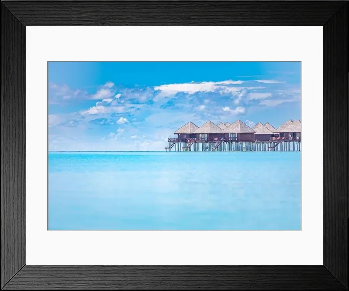 Framed Print : Tropical panorama, luxury water villa resort with wooden pier or jetty. Luxury travel destination background for summer holiday vacation in Maldives Framed Print : Tropical panorama, luxury water villa resort with wooden pier or jetty. Luxury travel destination background for summer holiday vacation in Maldives