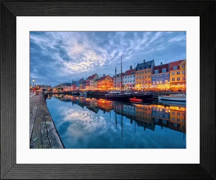 Framed Print : Copenhagen, Denmark - July 02, 2021: Famous old Nyhavn port in the center of Copenhagen, Denmark during summer night. Copenhagen iconic view Framed Print : Copenhagen, Denmark - July 02, 2021: Famous old Nyhavn port in the center of Copenhagen, Denmark during summer night. Copenhagen iconic view