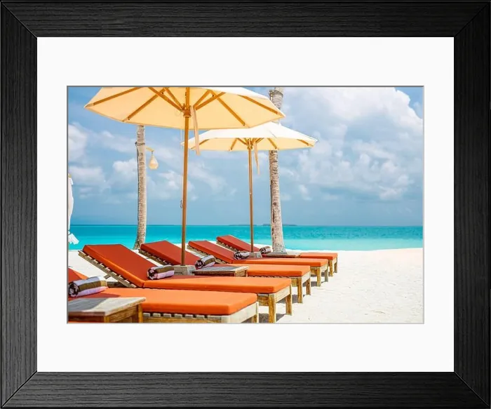 Framed Print : Beautiful tropical island scenery, two sun beds, loungers, umbrella. White sand, sea view with horizon, idyllic blue sky, calmness and relaxation Framed Print : Beautiful tropical island scenery, two sun beds, loungers, umbrella. White sand, sea view with horizon, idyllic blue sky, calmness and relaxation
