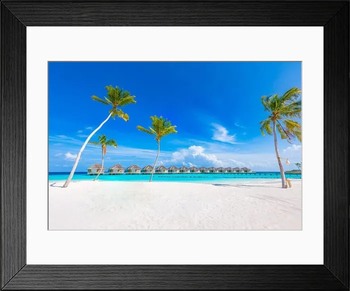 Framed Print : Idyllic tropical beach landscape with water villas and bungalows. Design of tourism summer vacation holiday destination concept. Luxury island beach Framed Print : Idyllic tropical beach landscape with water villas and bungalows. Design of tourism summer vacation holiday destination concept. Luxury island beach