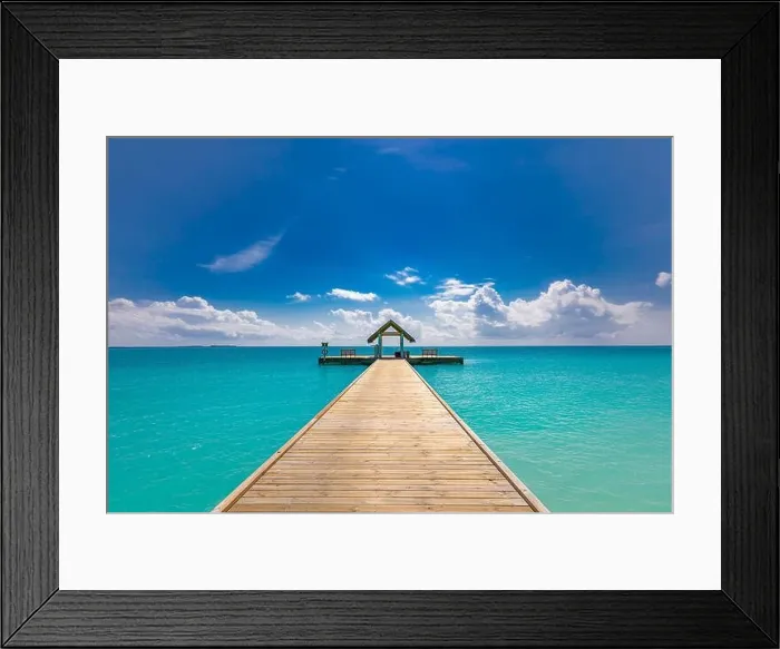 Framed Print : Amazing seascape panorama at Maldives. Luxury resort villas seascape under sunny blue sky. Water bungalow and jetty, ocean lagoon Framed Print : Amazing seascape panorama at Maldives. Luxury resort villas seascape under sunny blue sky. Water bungalow and jetty, ocean lagoon