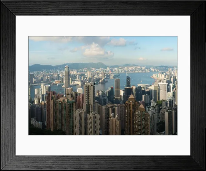 Framed Print : Aerial view of Hong Kong skyline and Victoria Harbor with blue sky in Hong Kong. Asia Framed Print : Aerial view of Hong Kong skyline and Victoria Harbor with blue sky in Hong Kong. Asia