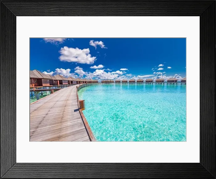 Framed Print : Maldives beach resort panoramic landscape. Long wooden pier with amazing sea beach. Tropical paradise, summer vacation, travel destination Framed Print : Maldives beach resort panoramic landscape. Long wooden pier with amazing sea beach. Tropical paradise, summer vacation, travel destination