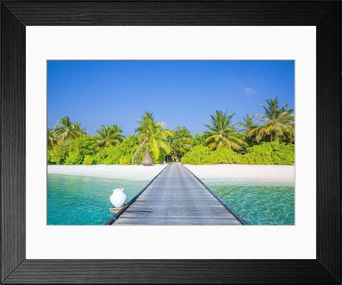 Framed Print : Beautiful tropical Maldives island with beach jetty sea and coconut palm trees on blue sky for nature luxury holiday vacation background concept Framed Print : Beautiful tropical Maldives island with beach jetty sea and coconut palm trees on blue sky for nature luxury holiday vacation background concept