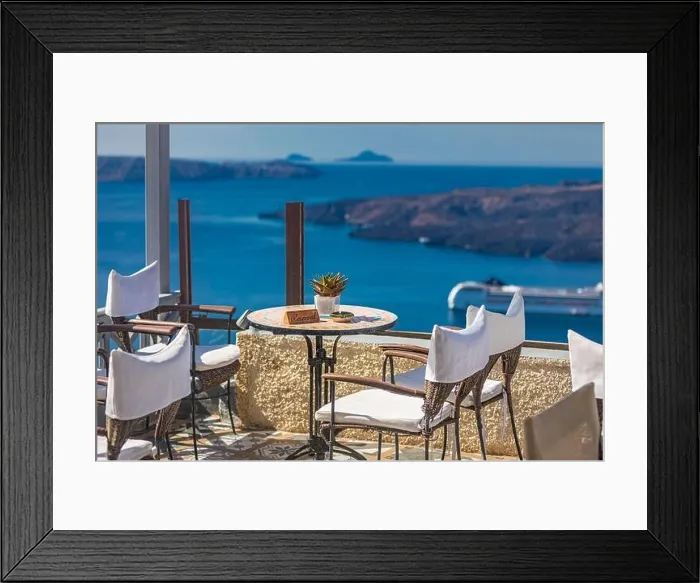 Framed Print : Beautiful terrace with sea view. Santorini island, Greece. Summer romantic travel restaurant on terrace with view on sea, Santorini island, Cyclades Framed Print : Beautiful terrace with sea view. Santorini island, Greece. Summer romantic travel restaurant on terrace with view on sea, Santorini island, Cyclades