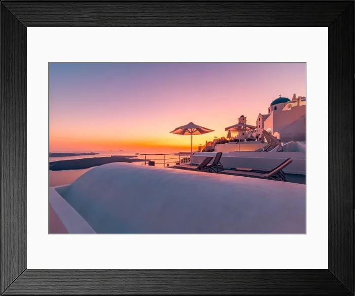 Framed Print : Terrace at sunset in Santorini Island, Greece. Beautiful resort caldera view sunset sky. Relax vibes, umbrella and chairs, table. Summer vacation Framed Print : Terrace at sunset in Santorini Island, Greece. Beautiful resort caldera view sunset sky. Relax vibes, umbrella and chairs, table. Summer vacation