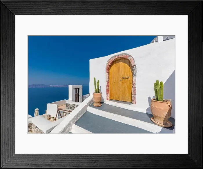 Framed Print : Fantastic travel background, Santorini urban landscape. Red door, gate with stairs white architecture under blue sky. Idyllic summer vacation luxury Framed Print : Fantastic travel background, Santorini urban landscape. Red door, gate with stairs white architecture under blue sky. Idyllic summer vacation luxury