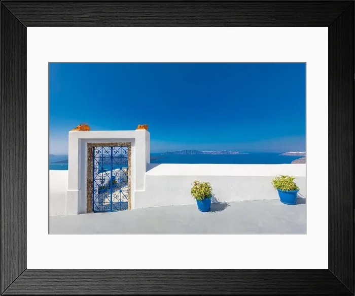 Framed Print : Fantastic travel background, Santorini urban landscape. Red door, gate with stairs white architecture under blue sky. Idyllic summer vacation luxury Framed Print : Fantastic travel background, Santorini urban landscape. Red door, gate with stairs white architecture under blue sky. Idyllic summer vacation luxury