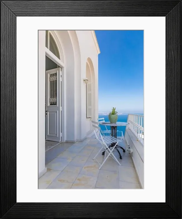 Framed Print : Romantic view, chairs and table with sea view over caldera from resort hotel terrace. Amazing summer travel landscape, luxury vacation Framed Print : Romantic view, chairs and table with sea view over caldera from resort hotel terrace. Amazing summer travel landscape, luxury vacation