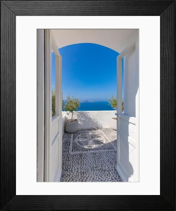 Framed Print : Fantastic travel background, Santorini urban landscape. White door or gate with stairs and white architecture under blue sky. Idyllic summer vacation Framed Print : Fantastic travel background, Santorini urban landscape. White door or gate with stairs and white architecture under blue sky. Idyllic summer vacation