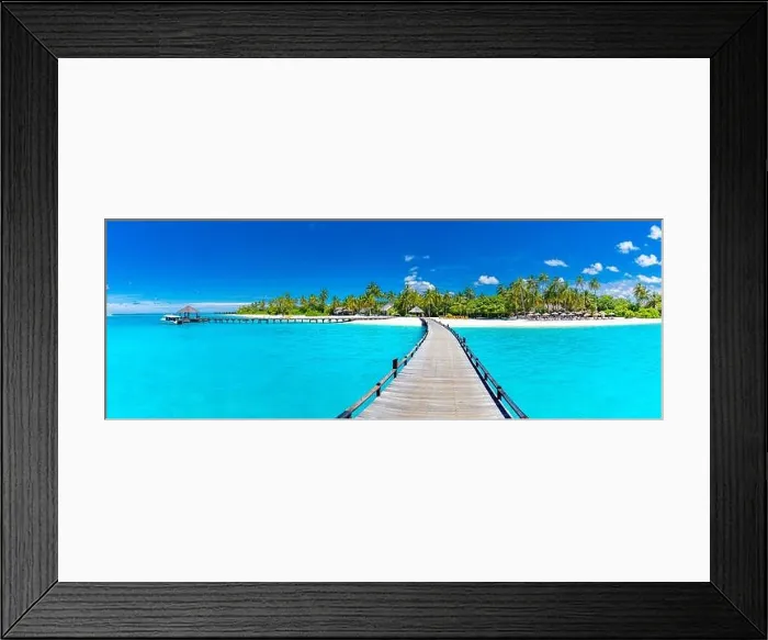 Framed Print : Maldives beach resort panoramic landscape. Long wooden pier with amazing sea beach. Tropical paradise, summer vacation, travel destination Framed Print : Maldives beach resort panoramic landscape. Long wooden pier with amazing sea beach. Tropical paradise, summer vacation, travel destination