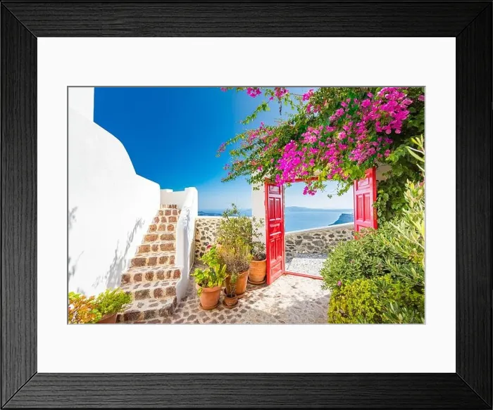 Framed Print : Fantastic travel background, Santorini urban landscape. Red door or gate with stairs and white architecture under blue sky. Idyllic summer vacation Framed Print : Fantastic travel background, Santorini urban landscape. Red door or gate with stairs and white architecture under blue sky. Idyllic summer vacation
